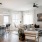 Spacious and well lit kitchen with wood flooring and stainless steel appliances