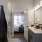 bathroom with a large mirror and ample lighting